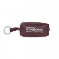 Schlüsseltasche aus farbigem Kunstleder mit mittigem Reißverschluss Schlüsseltasche aus farbigem Kunstleder mit mittigem Reißverschluss